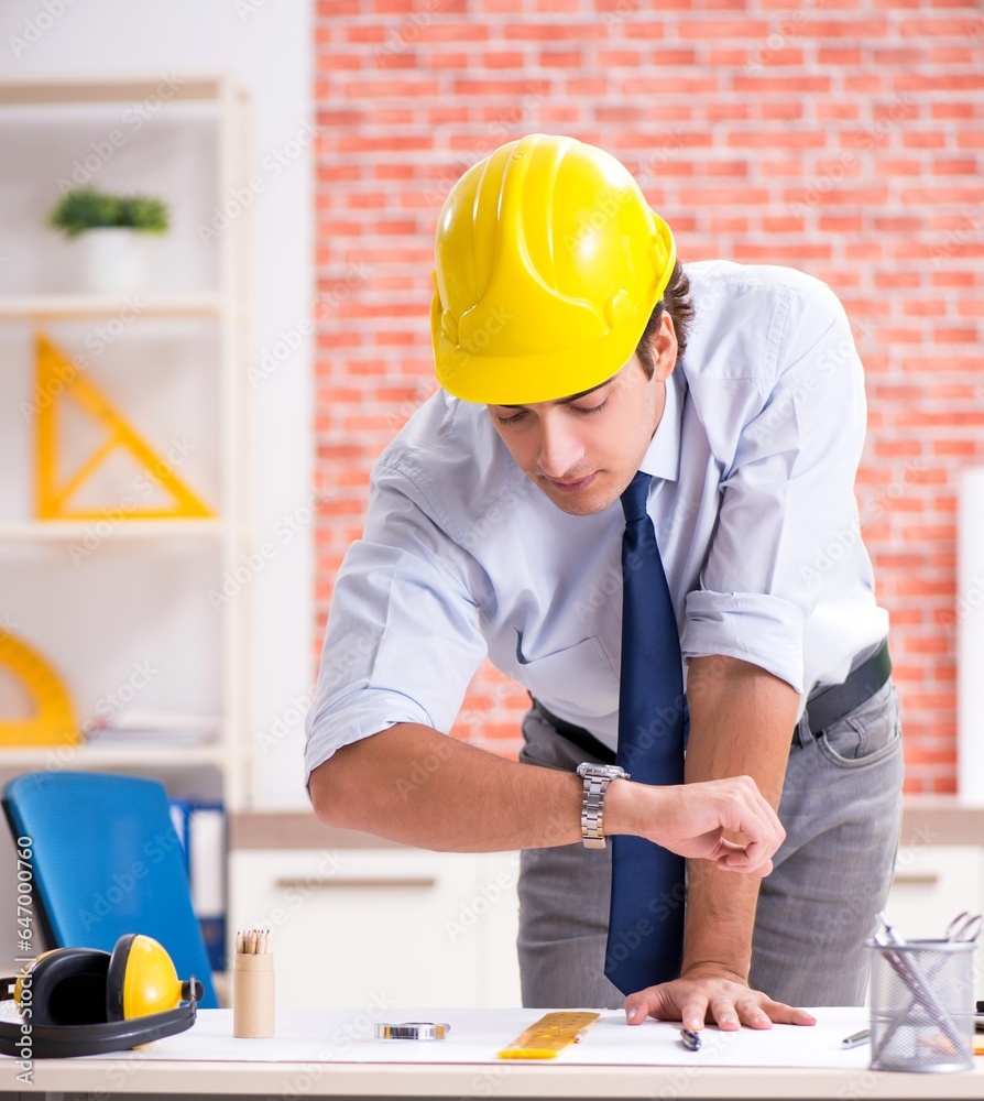Construction supervisor working on blueprints Construction supervisor working on blueprints