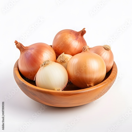 onions in a wooden bowl isolated on white