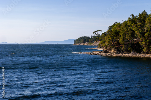 Shoreline of Gabriola Island looking to the Malaspina Galleries and Vancouver Island and the Coast Mountains of British Columbia, Canada photo