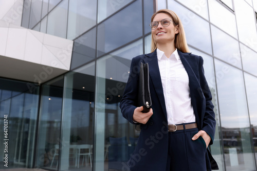 Real estate agent with leather portfolio outdoors. Space for text