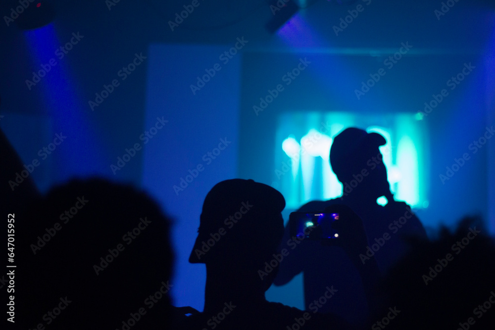 silhouette of people dancing on stage