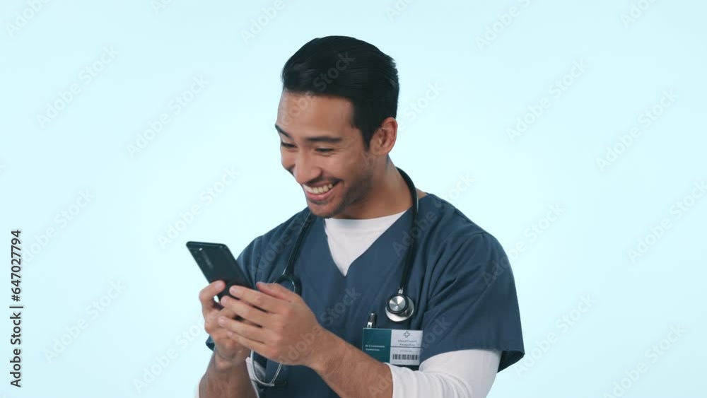 Happy asian man, phone and doctor in good news, winning or celebration against a studio background. Excited male person, medical or healthcare nurse with fist pump or mobile smartphone in achievement Happy asian man, phone and doctor in good news, winning or celebration against a studio background. Excited male person, medical or healthcare nurse with fist pump or mobile smartphone in achievement