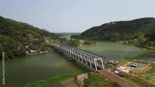 Wallpaper Mural 4k drone view Railway bridge over the River with a green forest background Torontodigital.ca