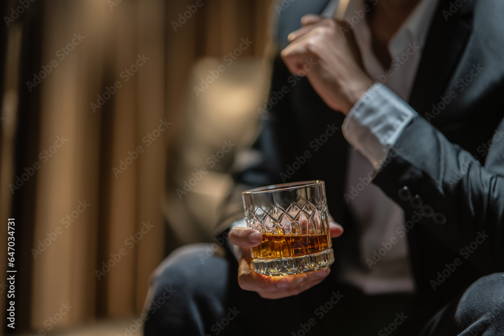 Businessmen in suits drinking  Celebrate whiskey.
