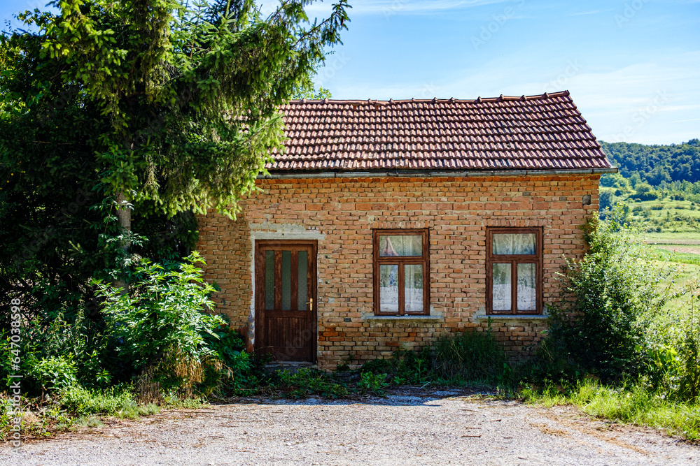 abandoned house in a poor part of northern Croatia, summer, noon abandoned house in a poor part of northern Croatia, summer, noon