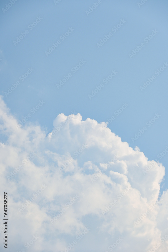 beautiful blue sky and white fluffy cloud with sunrise in the morning, natural background
