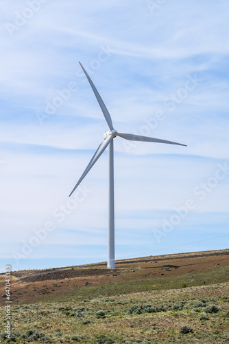 Single wind turbine on a dry landscape, clean green energy generation 