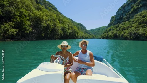 Le Verdon Gorge or Gorges Du Verdon lake of Sainte Croix, Provence, France, Alpes Cote d Azur, blue green lake with boats in France Provence. Europe couple men woman mid age on vacation Provence  photo
