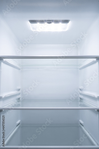 refrigerator interior with light in the upper area