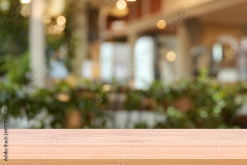 Wooden board empty table background. abstract blurred cafe background