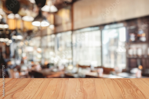 Wooden board empty table background. abstract blurred cafe background