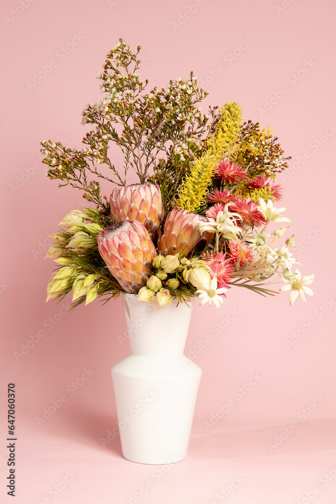 Vase of pink and yellow florals