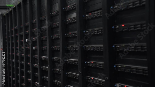 Servers like these are used for cloud computing, Data Center With Multiple Rows of Fully Operational Server Racks.