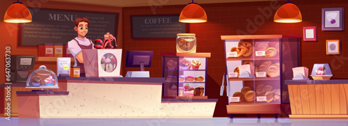 Bake shop interior. Young male assistant or owner of bread and dessert store packs cake to order behind counter. Cartoon bakery inside with pastries in glass showcase, cash register and coffee machine