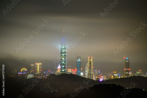 On the eve of the typhoon, fast-moving clouds and fog enveloped the entire city. Clouds, lights and architecture combine to create a dreamlike landscape. © twabian