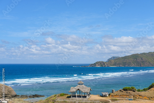 view of the sea from the hill, beautiful view from the top of Seger Hill, Bukit Seger Lombok, view of the coast of the sea, beach in the summer, dry season at Lombok, view of the sea and mountains