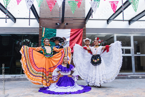 group of mexican dancers wearing traditional folk costume, portrait of young latin people in Mexico Latin America festival party, Independence day photo