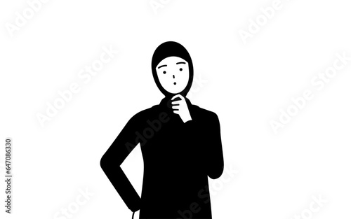 疑問を持って首をかしげるイスラムの女性