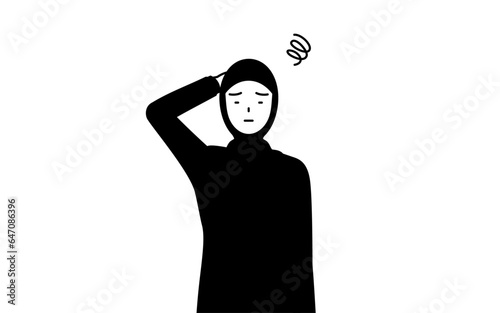 困って頭をかくイスラムの女性