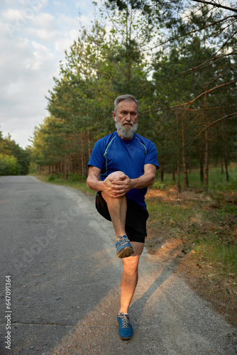 Senior man preparing for running physical training outdoors