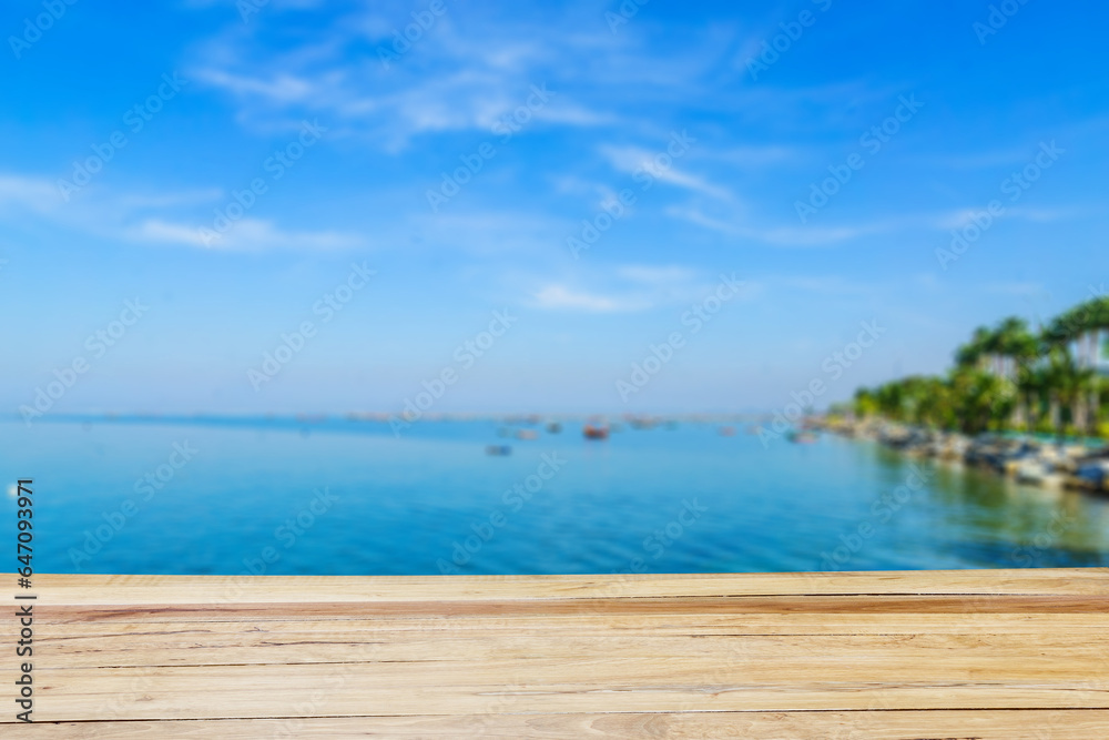 Fototapeta premium Empty wooden table and tropical beach view