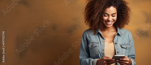 woman texting on cell phone Over Brown Background 