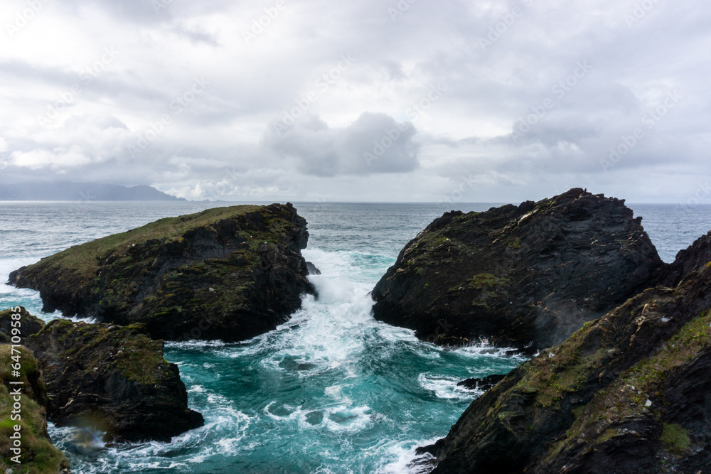 View of the cliffs of Punta Herbosa, near Esteiro beach, with waves. O Barqueiro, A Coruña, Spain.