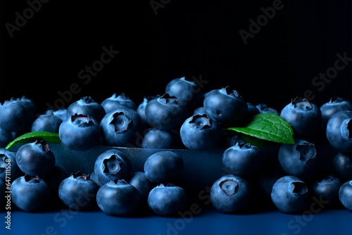 Blueberries on dark paper with space photo