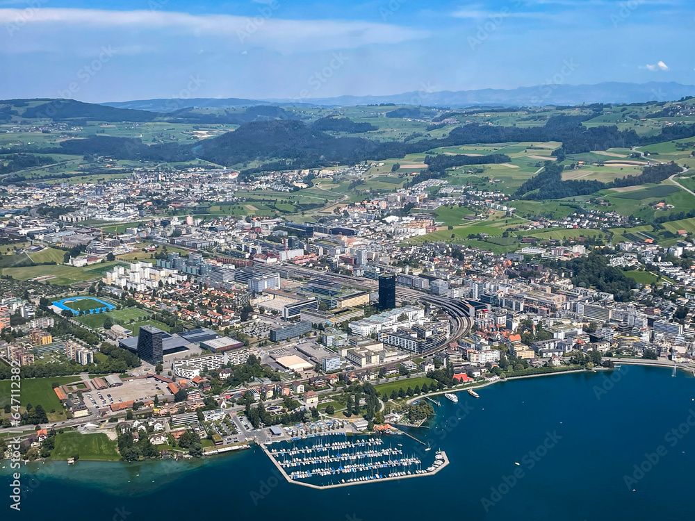 Aerial View of Zug, Switzerland with Lake and Mountains in the Background