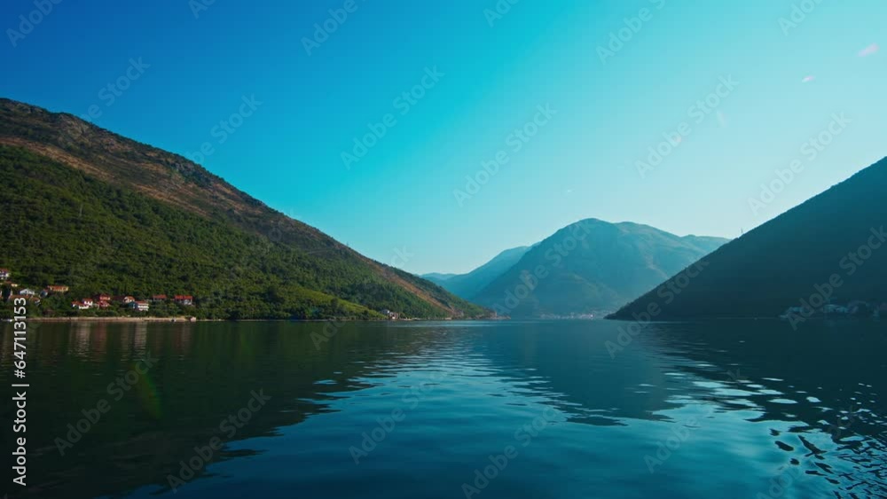seascape, view from the ship to the mountains and a small town on the bay, bright sunny day, summer travel concept
seascape, view from the ship to the mountains and a small town on the bay, bright sunny day, summer travel concept