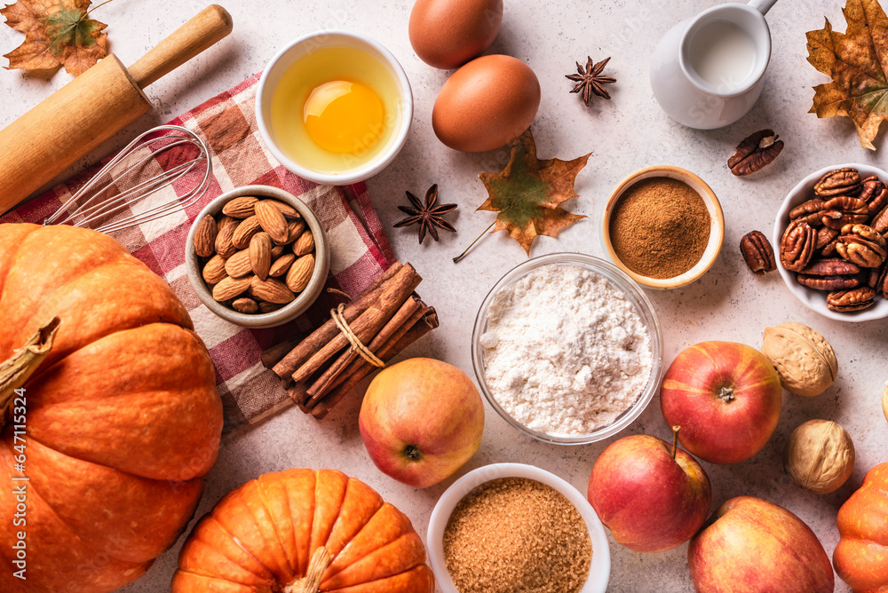 Autumn baking background with pumpkins, apples and nuts Autumn baking background with pumpkins, apples and nuts