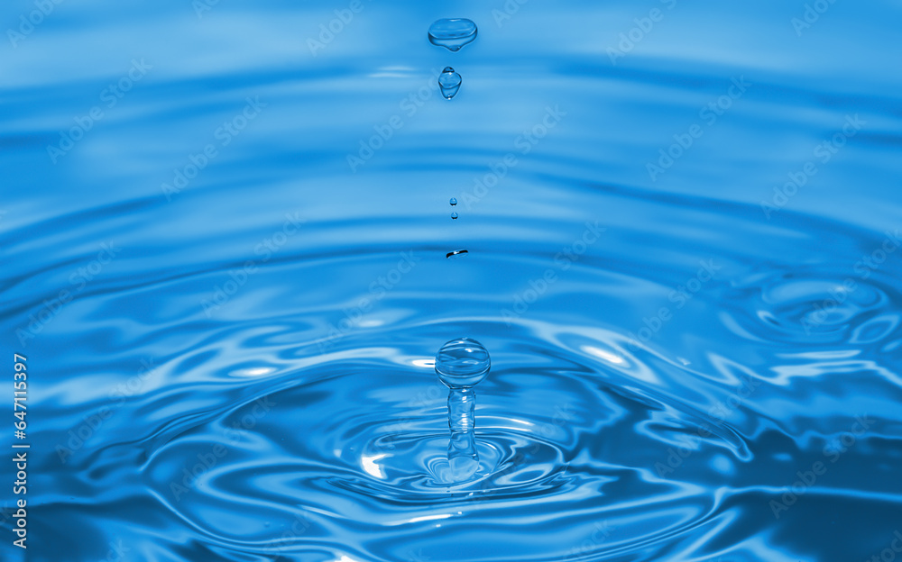 Clear aqua water droplet splashing in concentric circles, capturing refreshing purity. Clear aqua water droplet splashing in concentric circles, capturing refreshing purity.