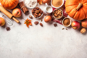 Autumn baking background with pumpkins, apples and nuts