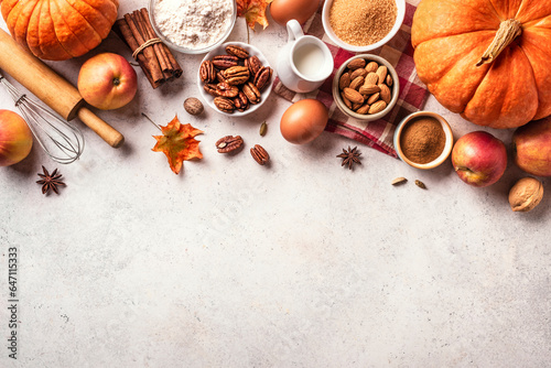 Autumn baking background with pumpkins, apples and nuts