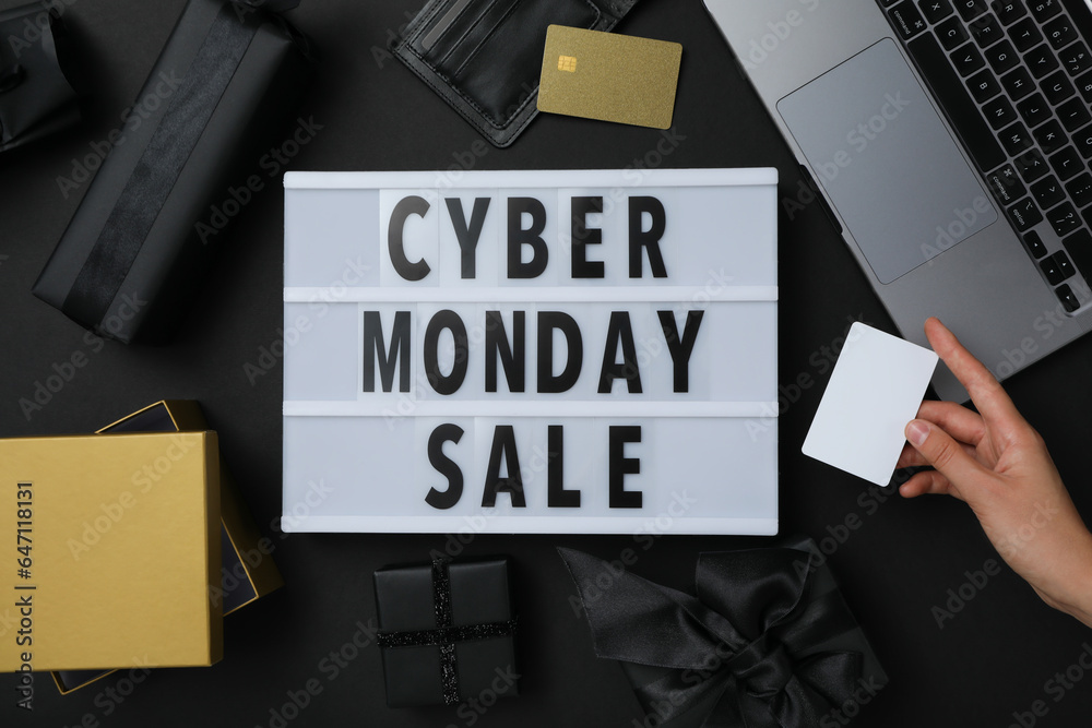 Cyber monday message on table with gifts and laptop. Cyber monday message on table with gifts and laptop.