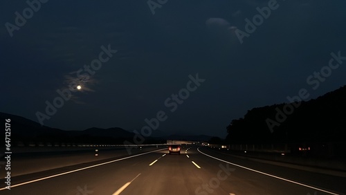 driving highway in the dark sky at night time