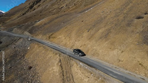 jeep off road car driving in Kaza in spiti valley in himalays small narrowed dangerous indian road exploring asia travelling concept  photo