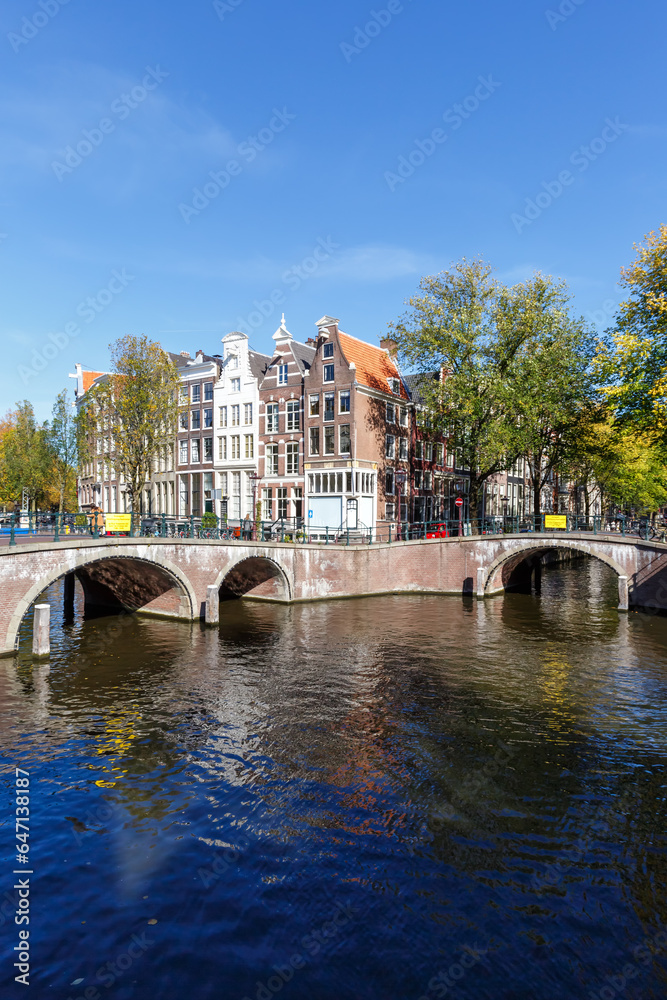Canal and bridges traditional Dutch houses at Keizersgracht portrait format in Amsterdam, Netherlands