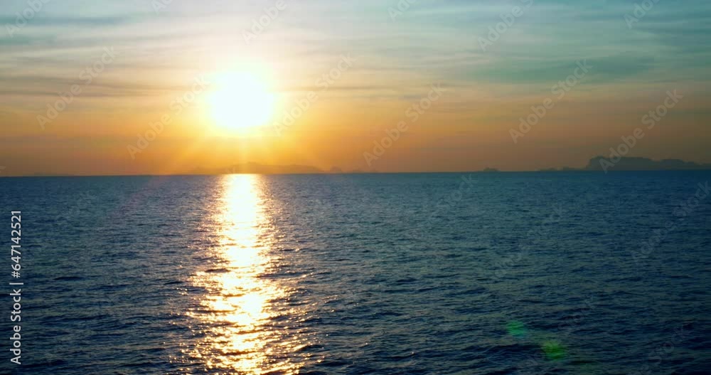 Amazing ocean scenery during sunset on coast. Sun path reflected in ocean surface. Cinematic video of sunset - bright sunlight shining through cloudscape over seascape. Concept enjoy inspiring sunset Amazing ocean scenery during sunset on coast. Sun path reflected in ocean surface. Cinematic video of sunset - bright sunlight shining through cloudscape over seascape. Concept enjoy inspiring sunset