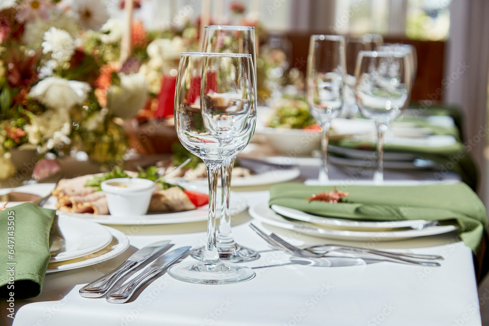 Within the elegant chamber, a finely set table showcases a harmonious blend of candles and flowers, their arrangement casting alluring shadows. The wedding exudes the aesthetics of Provence. Within the elegant chamber, a finely set table showcases a harmonious blend of candles and flowers, their arrangement casting alluring shadows. The wedding exudes the aesthetics of Provence.