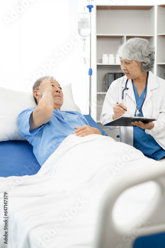 Female medicine doctor hand holding silver pen writing something on clipboard close up. Ward round, patient visit check, medical calculation and statistics concept.