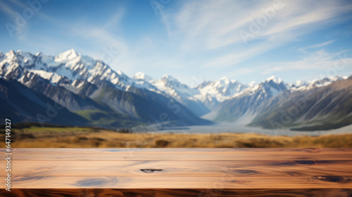 Empty wooden table top with blur background of mountain landscape