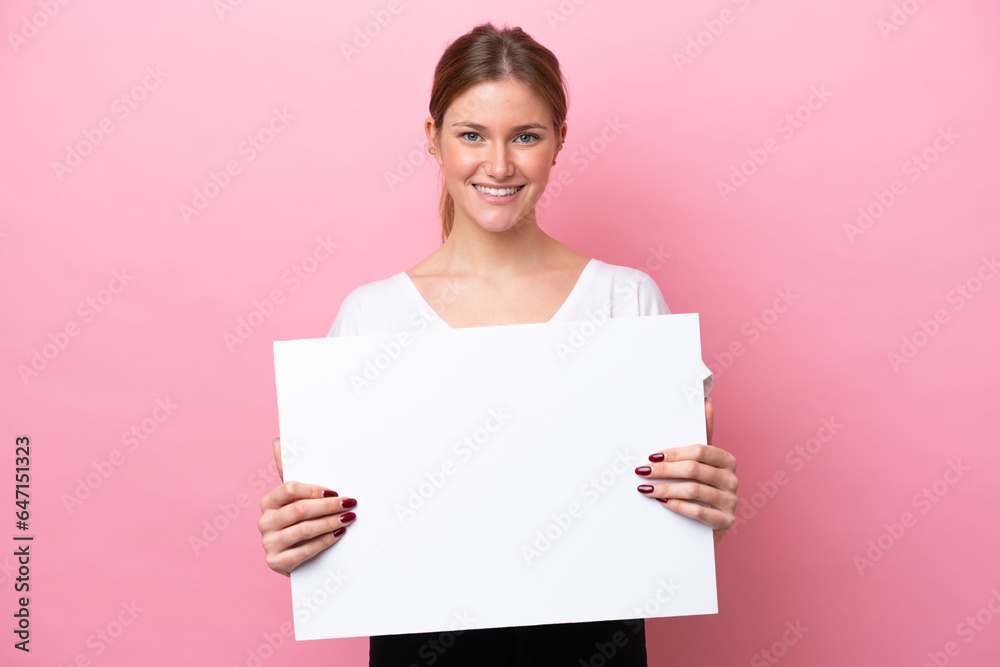 Young caucasian woman isolated on pink background holding an empty placard with happy expression Young caucasian woman isolated on pink background holding an empty placard with happy expression