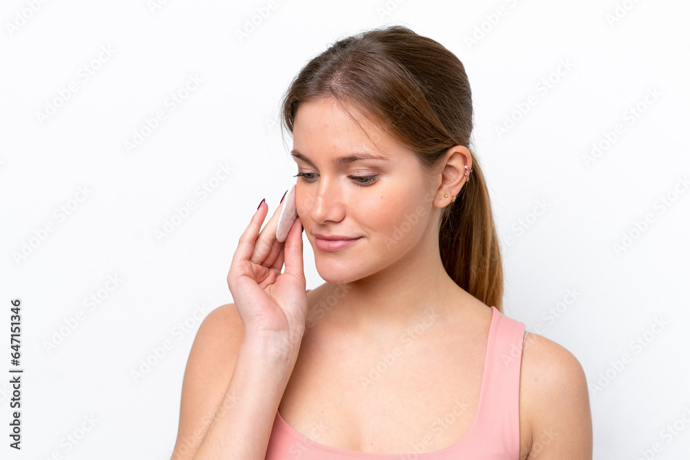 Young caucasian woman isolated on white background with cotton pad for removing makeup from her face Young caucasian woman isolated on white background with cotton pad for removing makeup from her face