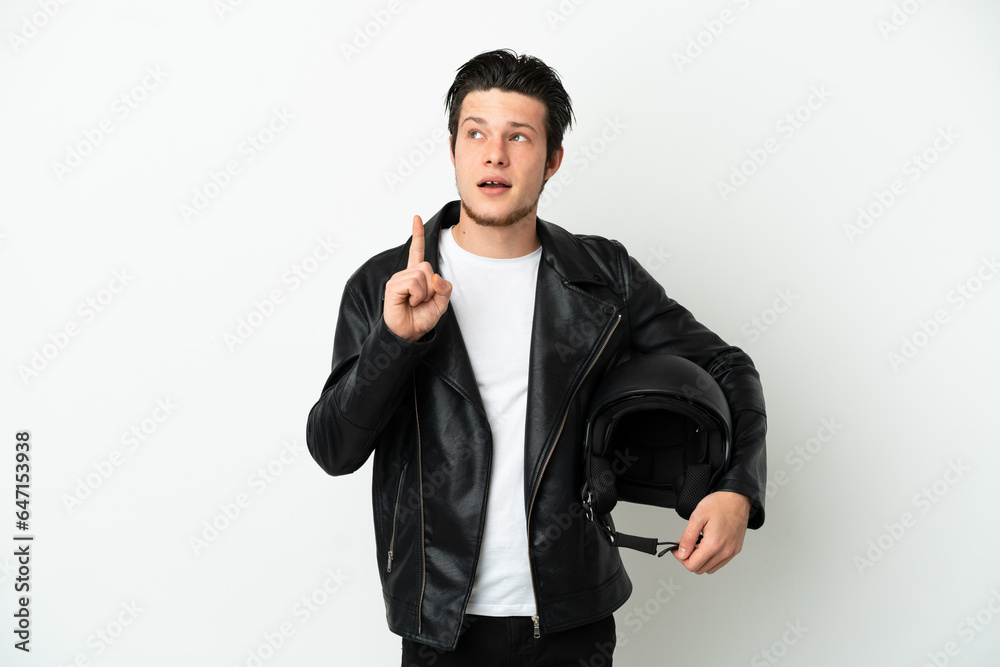 Russian man with a motorcycle helmet isolated on white background thinking an idea pointing the finger up Russian man with a motorcycle helmet isolated on white background thinking an idea pointing the finger up