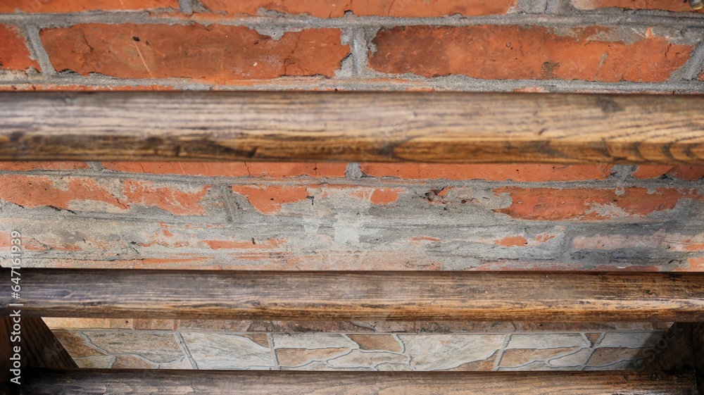 Obraz premium abstract rough dark background made of mixed materials, combination of wood, brick and stone in the texture of a facade fragment, exterior details made of different materials