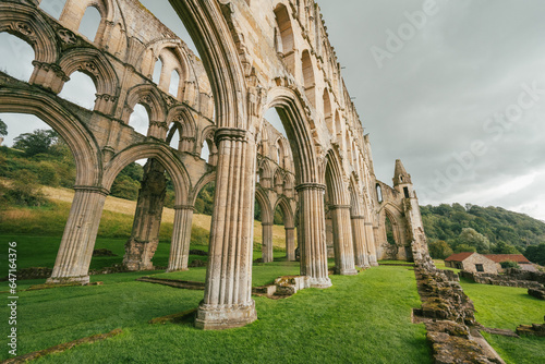 Church arches of abandoned Abbey monastery with no roof photo