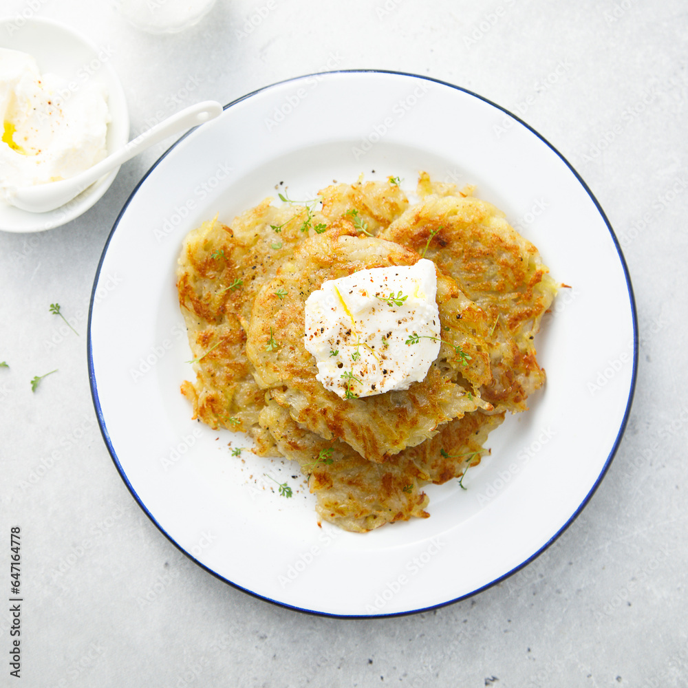 Homemade potato latkes with cream cheese Homemade potato latkes with cream cheese