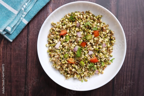 Sprouted moong beans. Protine rich salad. Healthy snack items. Sprouted Lentil Salad. Mixed with Onion, tomatoes, green chili and coriander. Copy space. Sprout Bhel.
