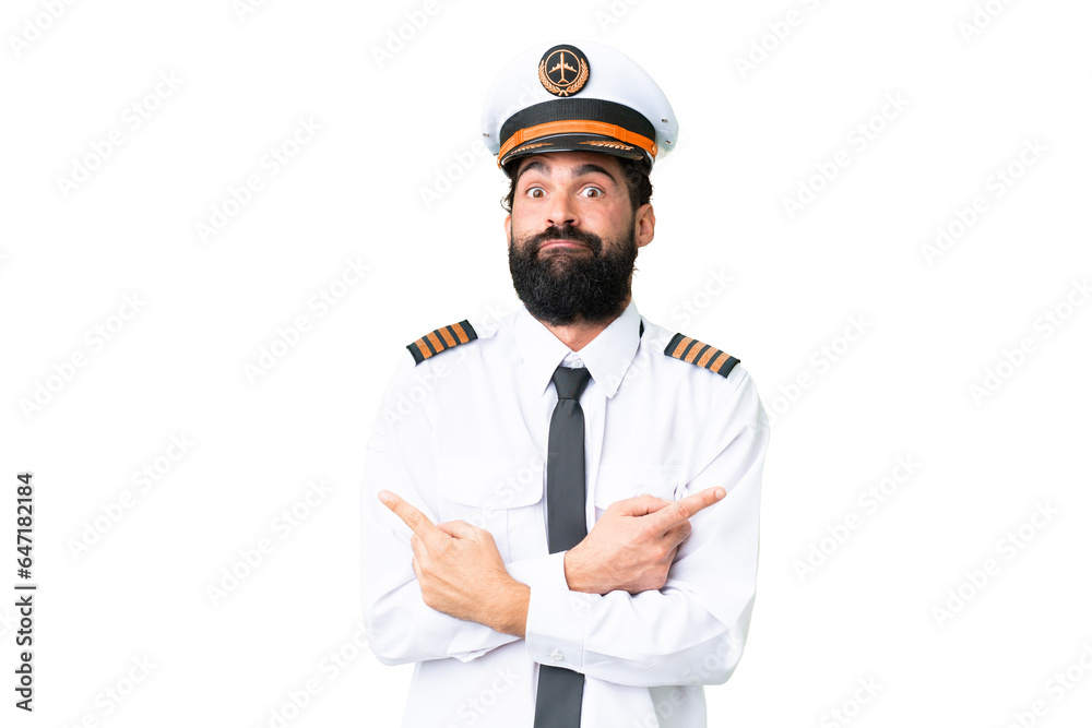 Airplane caucasian pilot man over isolated chroma key background pointing to the laterals having doubts Airplane caucasian pilot man over isolated chroma key background pointing to the laterals having doubts